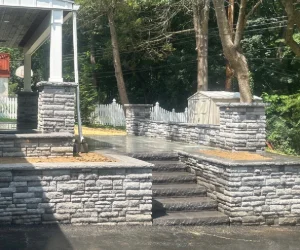 A finished masonry outdoor staircase with surrounding brick walls