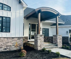 A finished masonry project around the front porch of a residential home