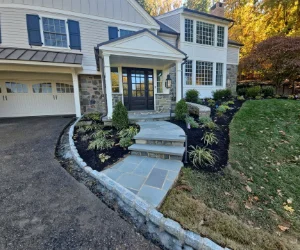 A path with pavers in the front yard of a home